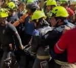 Cheers and applause as security guard rescued from rubble