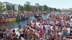 Crowds line Amsterdam’s canals for Pride boat parade Crowds line Amsterdam’s canals for Pride boat parade