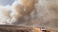 Fast-moving wildfires rage across southwestern US Fast-moving wildfires rage across southwestern US